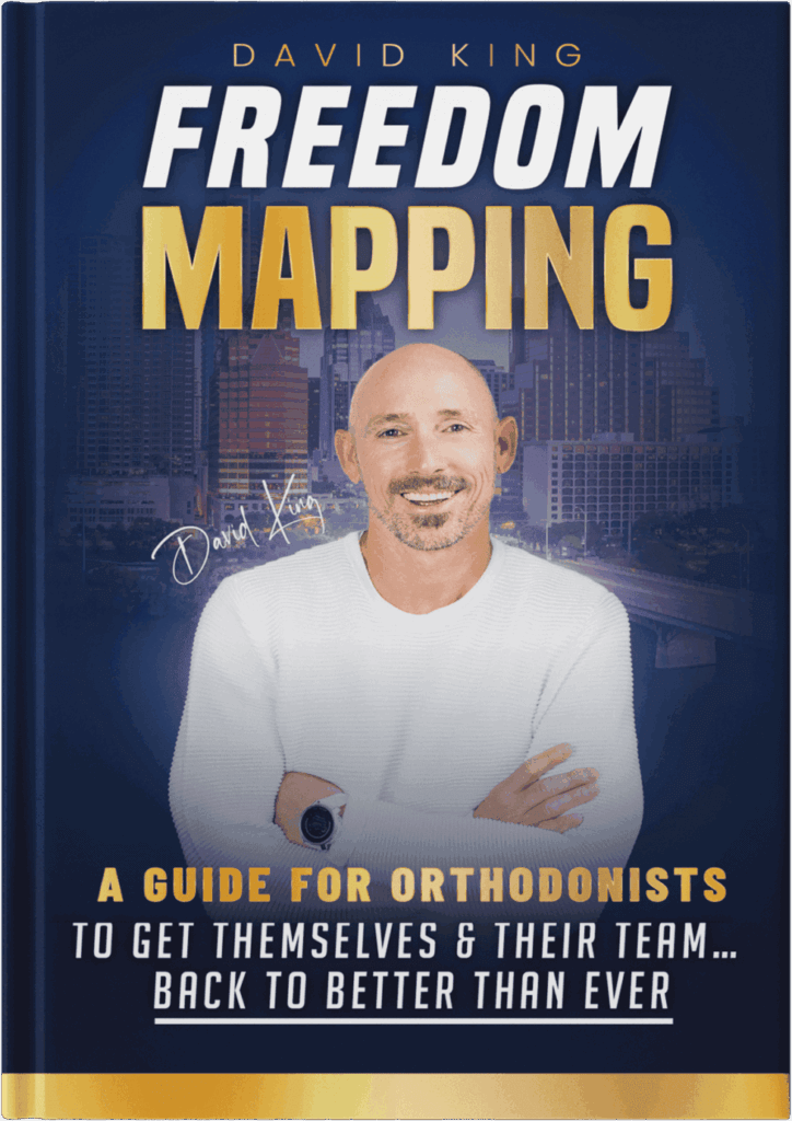 OrthoHeaven Book cover titled "Freedom Mapping" by David King, featuring a smiling man with crossed arms and city buildings in the background. Subtitle: "A Guide for Orthodontists to Achieve OrthoHeaven. Freedom Mapping