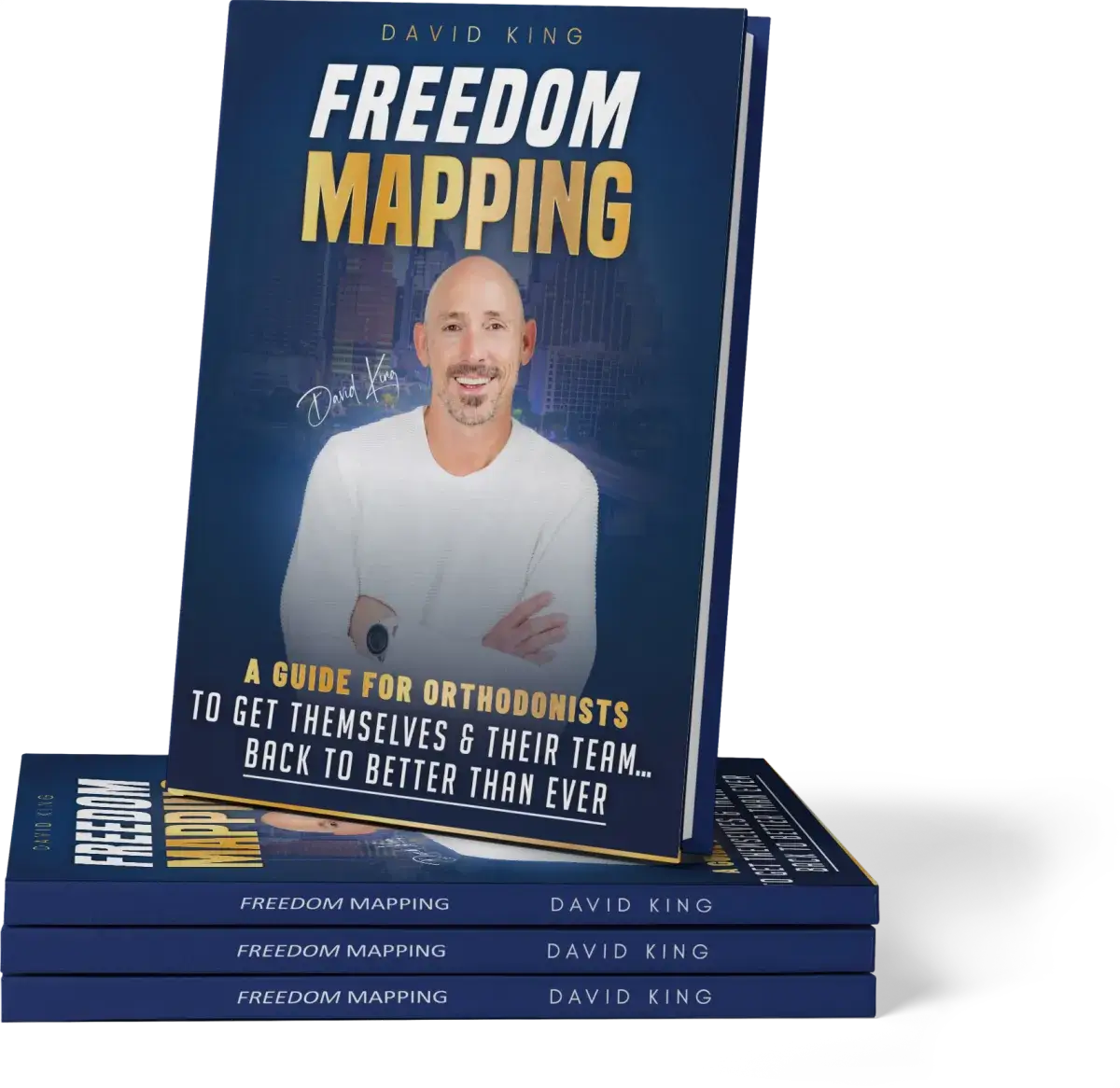 OrthoHeaven A stack of books titled "Freedom Mapping" by David King, featuring a smiling man on the cover and the subtitle, "A guide for orthodontists to get themselves & their team back to better than ever," endorsed by OrthoHeaven. Freedom Mapping